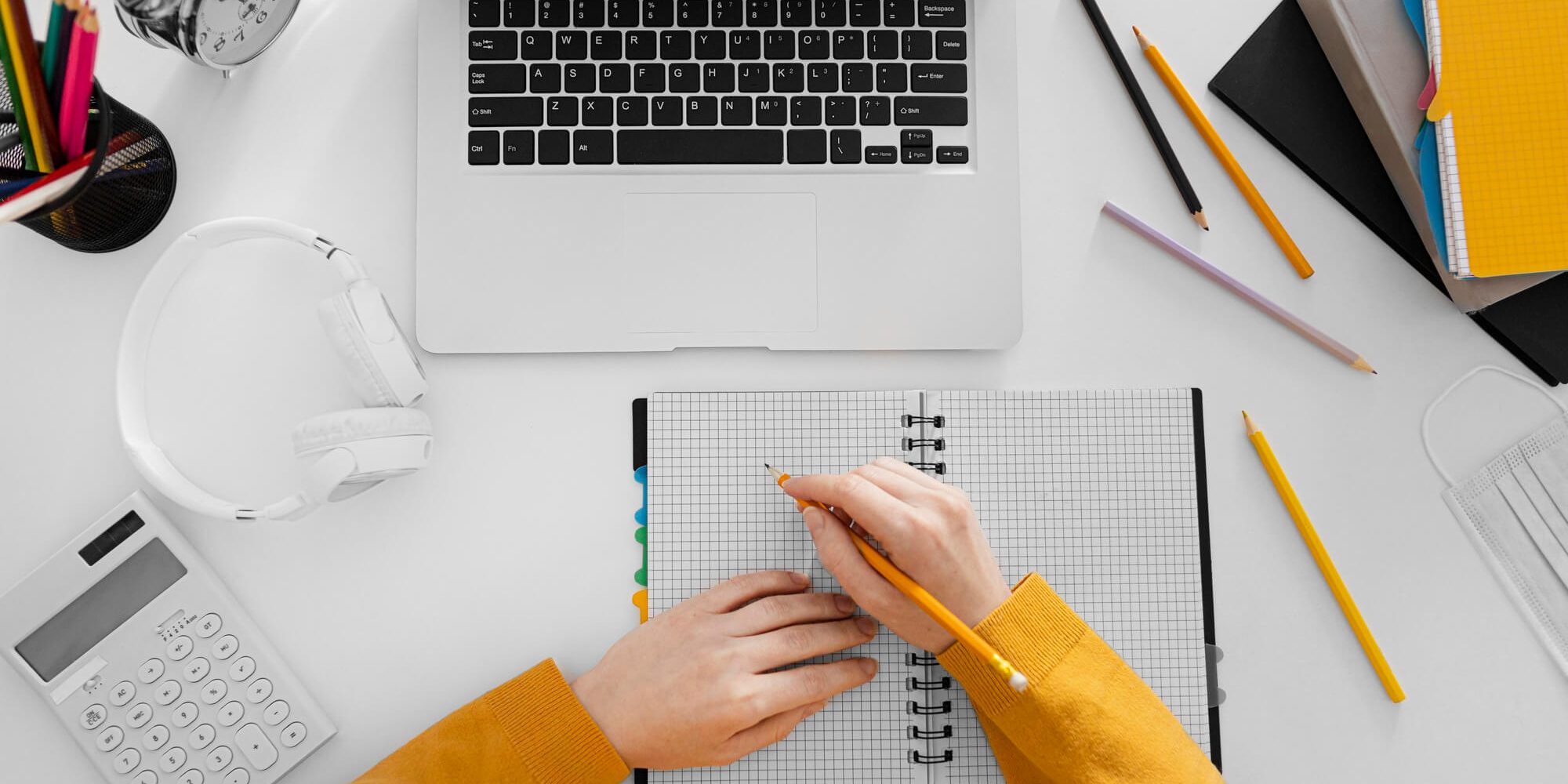 close-up-hand-writing-notebook-top-view (1) Grants Work For Nonprofits